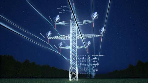 Torres de transmisión eléctrica y líneas eléctricas de noche